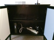 The cabinet by the entry way, is hiding/storing the wifi unit and other electronics
